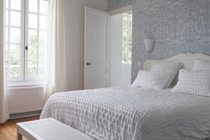 white and gray bed linen