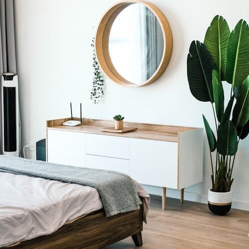 white wooden dresser with mirror