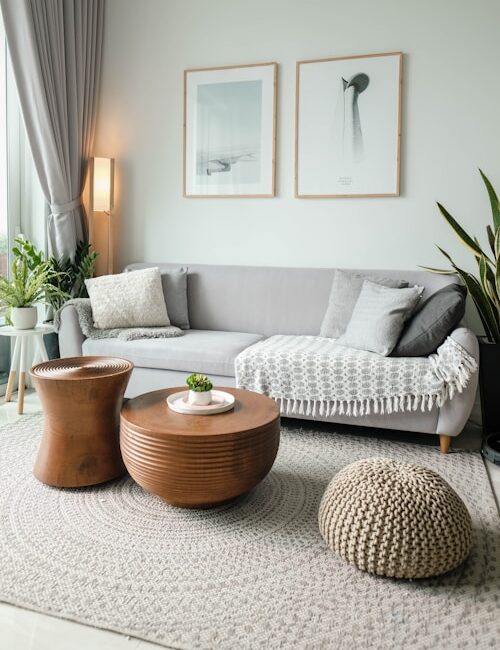 a living room filled with furniture and a large window