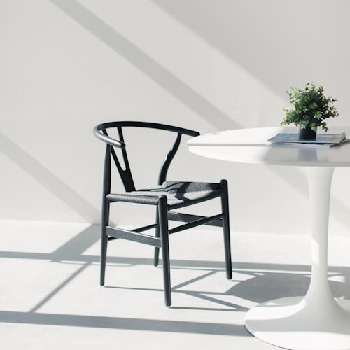 white wooden table with chairs