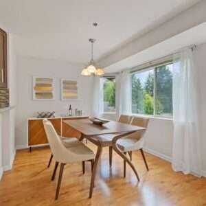 beige wooden table near window