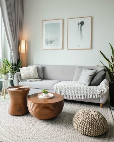 a living room filled with furniture and a large window