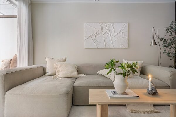 A living room filled with furniture and a large window